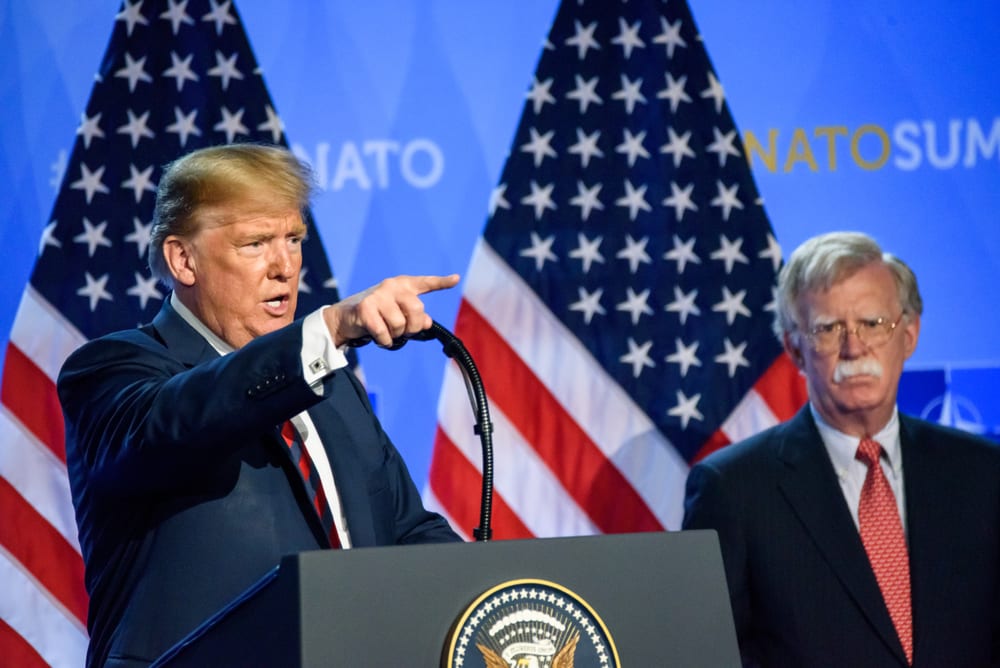 Tổng thống Trump và ông John Bolton trong một buổi họp báo tại Bỉ vào tháng 7 năm 2018.
