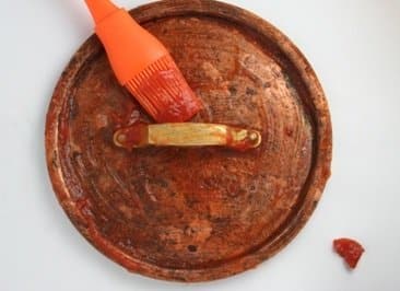 http://www.miss-thrifty.co.uk/2011/05/29/how-to-clean-copper-with-tomato-ketchup/ 